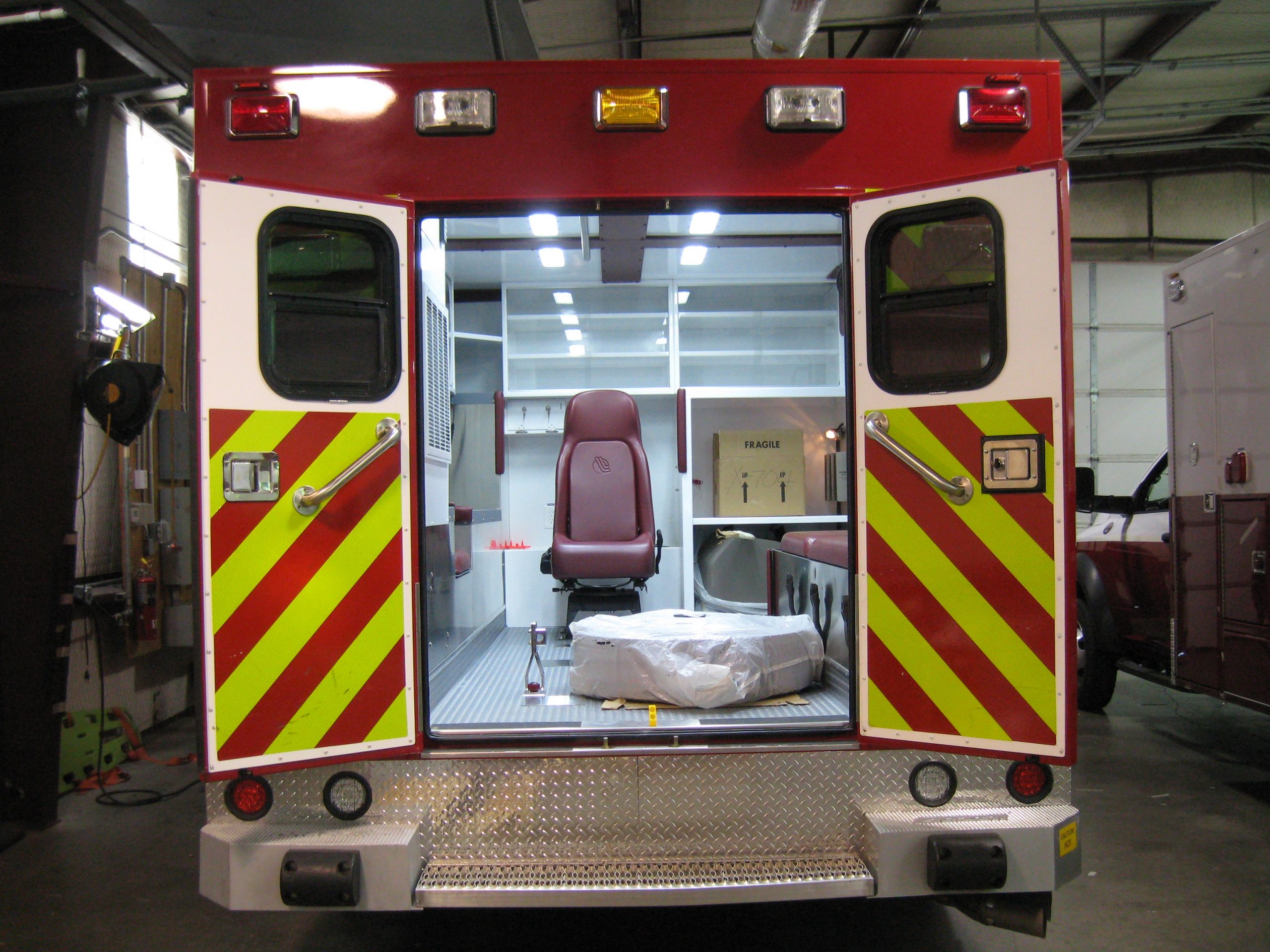 remounted ambulance with the back doors open revealing a new interior